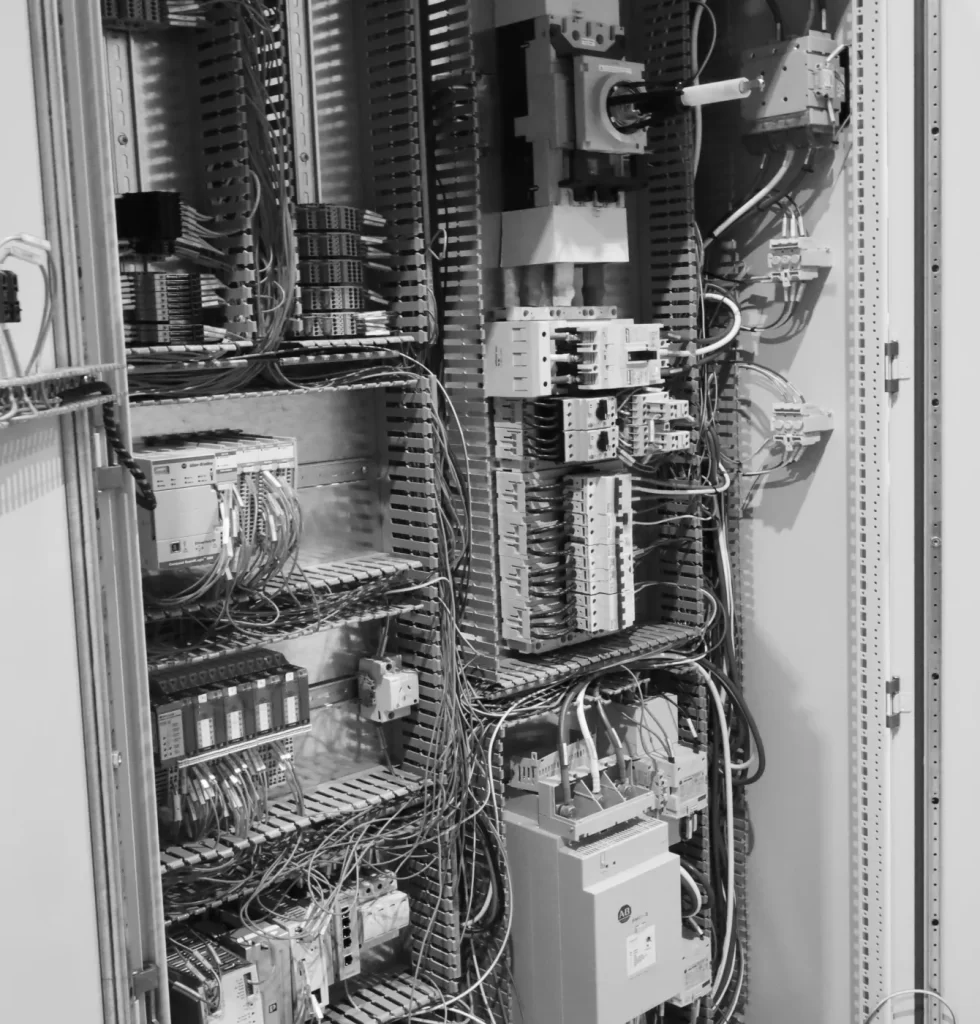 A black and white photo of an electrical cabinet.